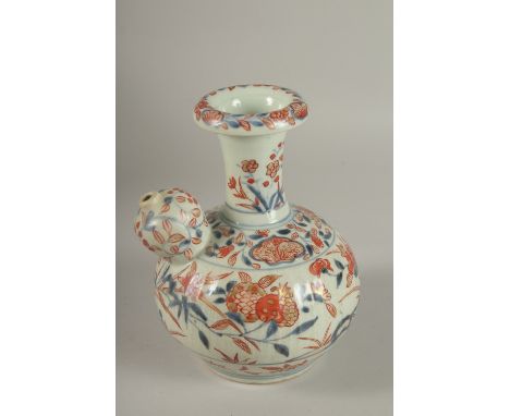 A JAPANESE IMARI PORCELAIN KENDI, painted with pomegranate and flora with gilt highlights, 19.5cm high.