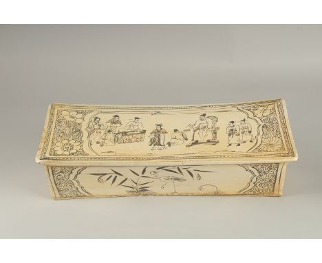 A VERY LARGE CHINESE GLAZED POTTERY PILLOW, painted with figures and animals, 45cm long.