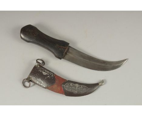 A 19TH CENTURY OTTOMAN HORN HILTED DAGGER, with silver inlaid steel mounted scabbard, 28cm long.