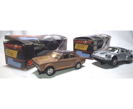 Two Scalextric cars with lights, C287 Ford Escort, brown, Westwood Racing, and C288 Porsche, silver, no 6. Both in fair - goo