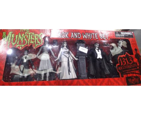 The Munsters, 1313 Mockingbird Lane, Black and White set figurines in good condition, boxed. P&amp;P Group 3 (£25+VAT for the