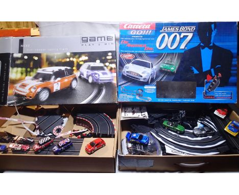 Two Carrera Go slot car machine sets to include James Bond Die Another Day and Mini Cooper racing, also includes extra cars, 