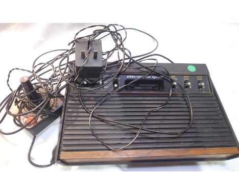 Atari CX-2600 video computer system with joystick, power cable and ariel connection. P&amp;P Group 2 (£18+VAT for the first l