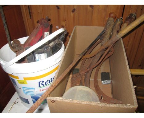 Box of tools : car jacks & scythes