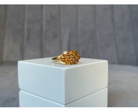 A 9ct Yellow Gold Citrine Ring - made up of 15 individual stones - Weighing 4.77 grams - Size P