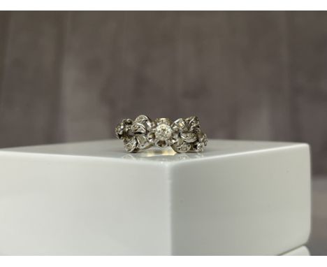 18ct White Gold Fancy Design Diamond Ring with a approximate .15ct centre stone - Weighing 2.78 grams - Size N
