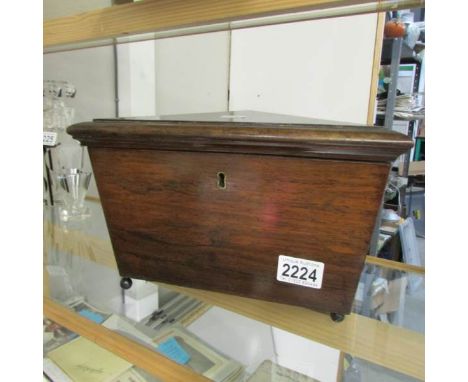 A Victorian Rosewood tea caddy (missing insides).