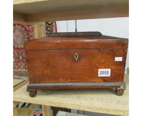 A Victorian walnut tea caddy.