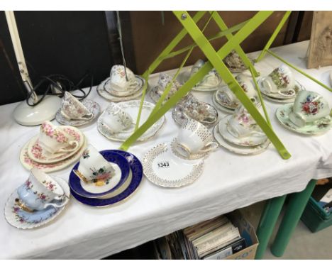 A quantity of porcelain cups and saucers trios