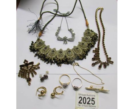 A mixed lot of jewellery including necklace with matching brooch, white stone necklace, silver ring etc.,