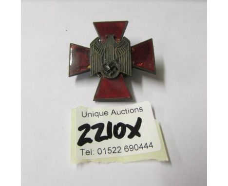 A scarce WW2 red enamel Nazi badge.