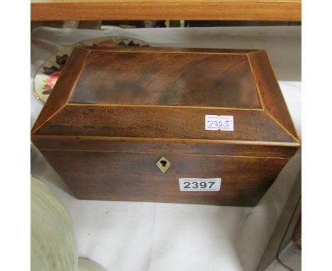 A Victorian mahogany tea caddy.