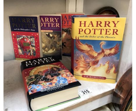 2 first edition Harry Potter books and 3 paperbacks