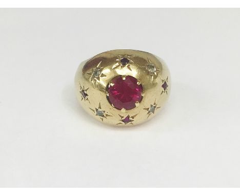 A 9ct gold ring set with 1ct ruby and diamonds (hall marked but indistinct) size J.