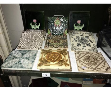 A quantity of vintage decorated tiles