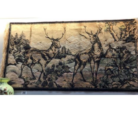 A tapestry wall hanging of deer