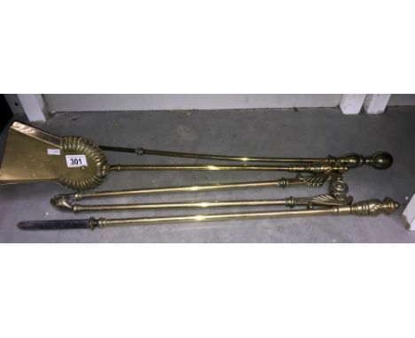 A quantity of Victorian brass fire tools