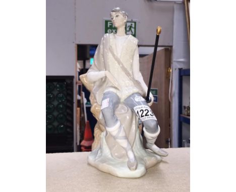 A large Lladro fisherman holding fish pole