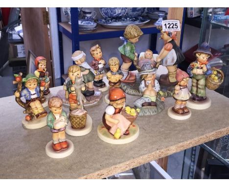 12 Goebel / Hummel figures including Kitty kisses, Easter Greeting, Tender Loving Care, Chic Girl etc.