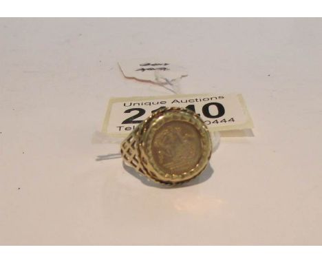 A 9ct gold ring set with a coin featuring St. George slaying the dragon and inscribed St. George on reverse with a portrait o