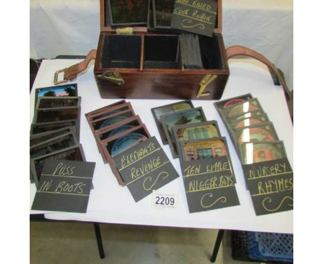 6 sets of coloured magic lantern slides including Puss in Boots, Ten Little Nigger Boys, Nursery Rhymes, Elephants Revenge, W