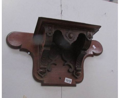 A mahogany wall shelf.