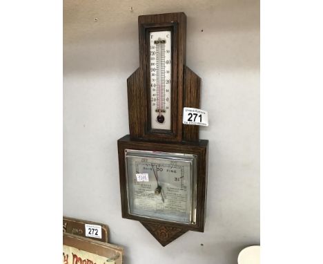 A 1930's oak aneroid barometer