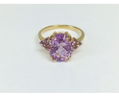 A 9ct gold and amethyst ring (hall marked GTV, Birmingham 2005), size M half.