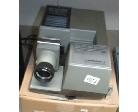 A boxed Hanimex Syllabus 2000 slide projector with instruction booklet.