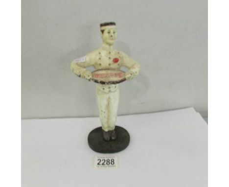 A vintage cast iron Coca Cola waiter figure.