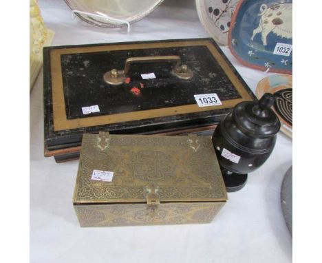 A large tin money box, a brass trinket box and a wooden trinket pot.