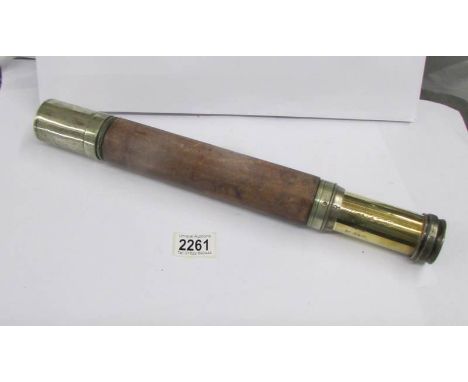 A mid 20th century brass and leather telescope marked W. Ottway &amp; Co., Ltd., Ealing, London, 1943, NO. 5910, NP46, with w