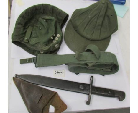 A 1941 pattern Spanish knife bayonet with scabbard, items of webbing, enamel badges, hat, cap and 2 metropolitan model police