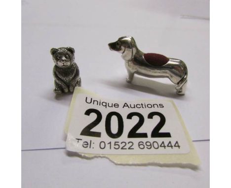 A silver dog pin cushion marked sterling and a silver Teddy bear pin cushion marked sterling 925.