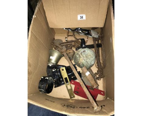 An interesting collection of old architectural iron work including scales, a spring doorbell, an iron, small animal trap etc.