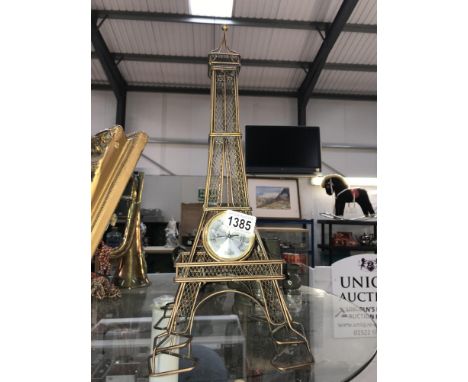 A wire ornament of the Eiffel tower barometer