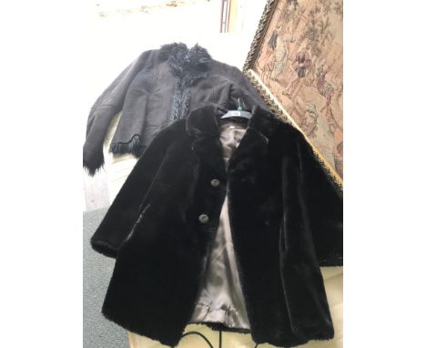 A ladies sheepskin jacket and a short ladies fur coat