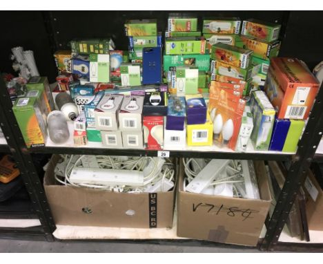 A shelf of new light bulbs including energy saving etc and a box of extension leads (2 shelves)