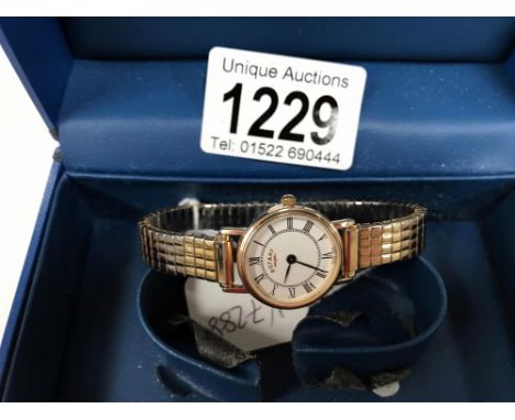 A 9ct gold rotary wristwatch on yellow metal and stainless steel bracelet