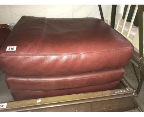 A large leather pouffe