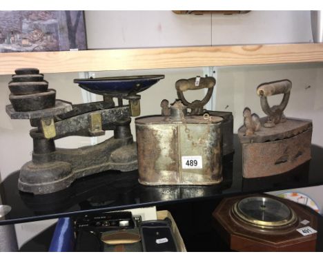 4 old items of iron work including 2 flat iron, waterbottle and a set of scales