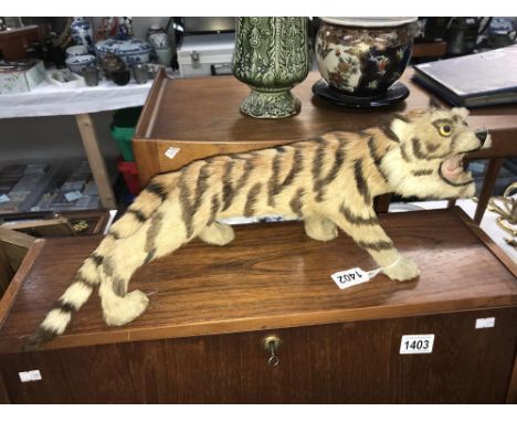 A vintage tourist model of a tiger with realistic faux fur