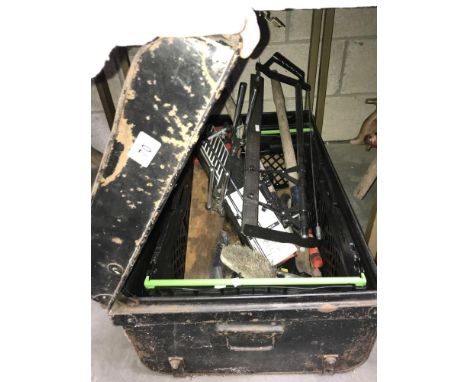 A tin trunk containing mitre saw etc.