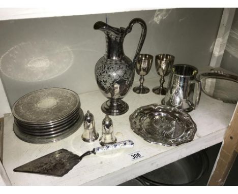 A shelf of silver plate including ewer tankard etc.