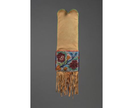 An Ojibwe pipe bag Northeast hide with two coloured glass bead floral panels, tassels and green bead edging, 55cm long. Prove