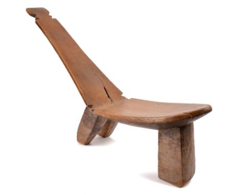 A Lobi stool Burkina Faso having a tapering back with a carved terminal, 64cm high. Provenance Richard Nathanson Collection, 
