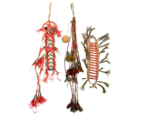 Three Sioux quilled hair ornaments Plains hide, cloth, natural and dyed quills, coloured glass beads, tin cones, feather and 