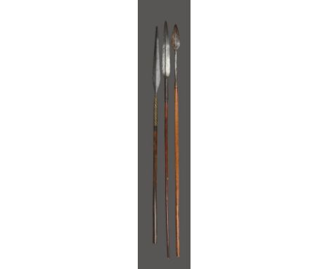 Three spears South Africa and Zimbabwe including a Zulu hunting spear, with a short blade and brass wire, 120.5cm long, a Zul