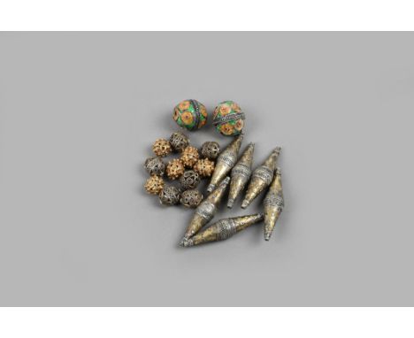 A pair of Moroccan enamel beads with a beaded girdle and circles in red, yellow and green enamel, 2.5cm long, six parcel-gilt