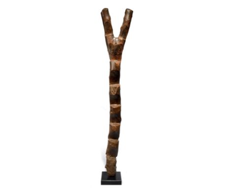 A Dogon ladder Mali 165.5cm high, on a base. (2) Provenance Owen Hargreaves, London. Richard Nathanson Collection, London.